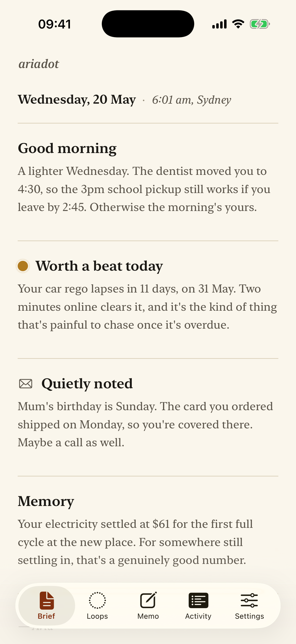 The Ariadot morning brief on an iPhone, showing a calm note about the day, a car registration due, a birthday, and a memory about the electricity bill.
